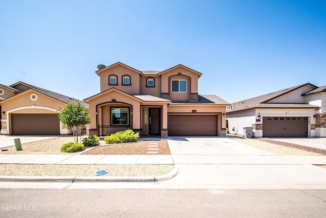 12320 Desert Path Ct, El Paso, TX 79938 - view of front of property featuring stucco siding, driveway, stone siding, and a porch
