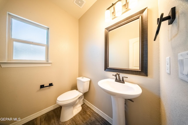 12320 Desert Path Ct, El Paso, TX 79938 - half bathroom featuring baseboards, toilet, wood finished floors, and vaulted ceiling