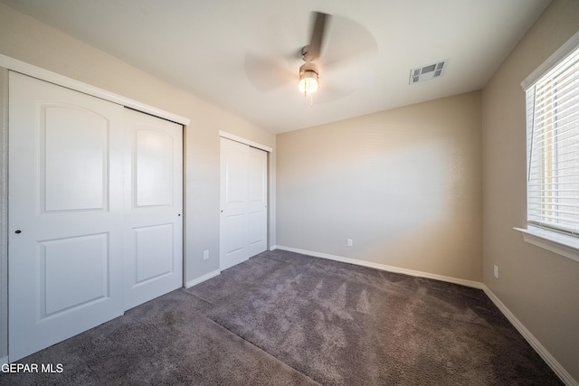 12320 Desert Path Ct, El Paso, TX 79938 - unfurnished bedroom with carpet floors, multiple closets, and baseboards