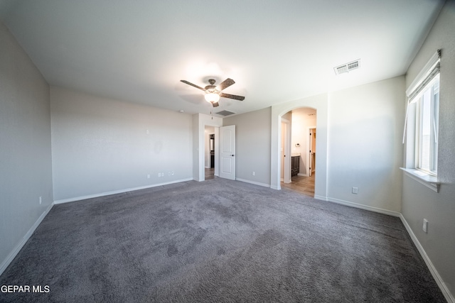 12320 Desert Path Ct, El Paso, TX 79938 - unfurnished bedroom featuring arched walkways, carpet, baseboards, and a ceiling fan