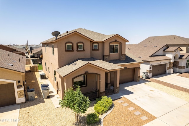 12320 Desert Path Ct, El Paso, TX 79938 - mediterranean / spanish house featuring stucco siding, driveway, a shingled roof, and an attached garage