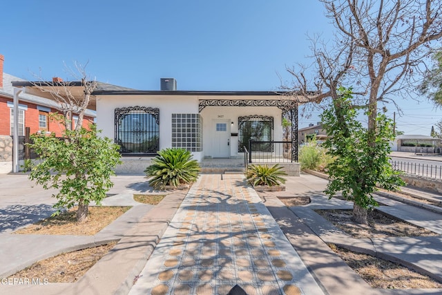 3427 Hamilton Ave, El Paso, TX 79930 - view of front of home featuring stucco siding, central AC unit, and a porch