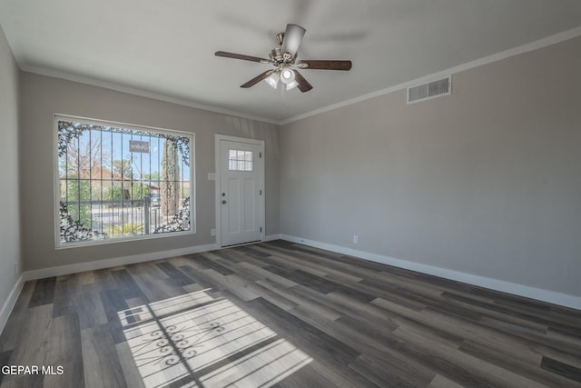3427 Hamilton Ave, El Paso, TX 79930 - foyer entrance featuring baseboards, ceiling fan, dark wood finished floors, and crown molding