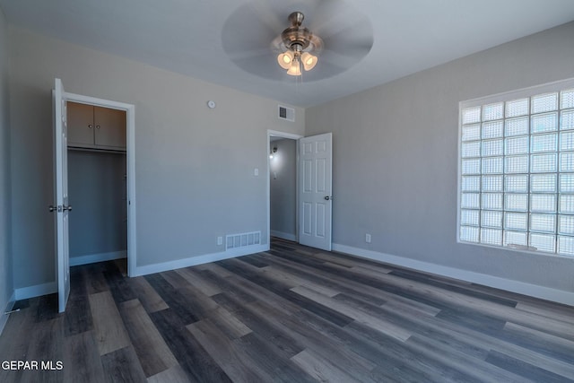3427 Hamilton Ave, El Paso, TX 79930 - unfurnished bedroom with dark wood-type flooring, baseboards, a ceiling fan, and a closet