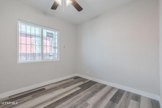 3427 Hamilton Ave, El Paso, TX 79930 - spare room featuring plenty of natural light, wood finished floors, ceiling fan, and baseboards