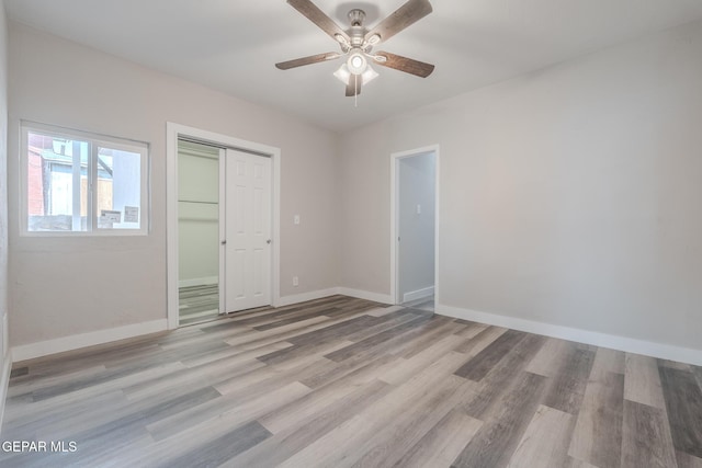 3427 Hamilton Ave, El Paso, TX 79930 - unfurnished bedroom with light wood-type flooring, a closet, baseboards, and a ceiling fan