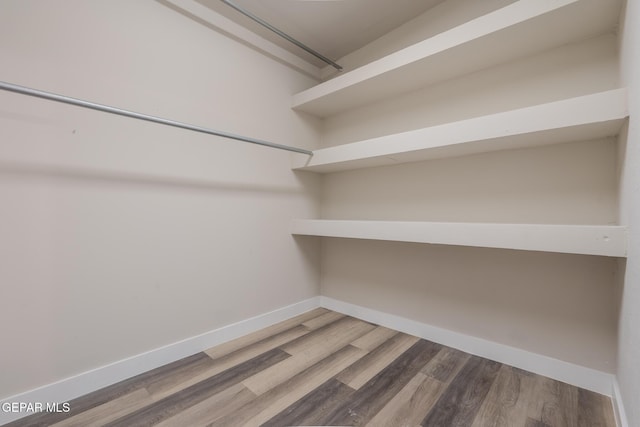 3427 Hamilton Ave, El Paso, TX 79930 - spacious closet featuring wood finished floors