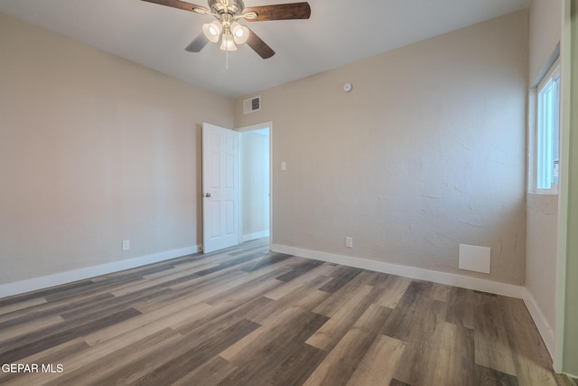 3427 Hamilton Ave, El Paso, TX 79930 - unfurnished room with baseboards, wood finished floors, and ceiling fan
