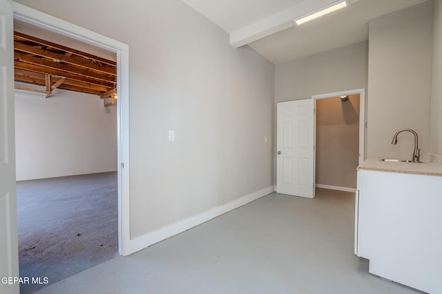 3427 Hamilton Ave, El Paso, TX 79930 - unfurnished bedroom with a sink, finished concrete floors, and baseboards