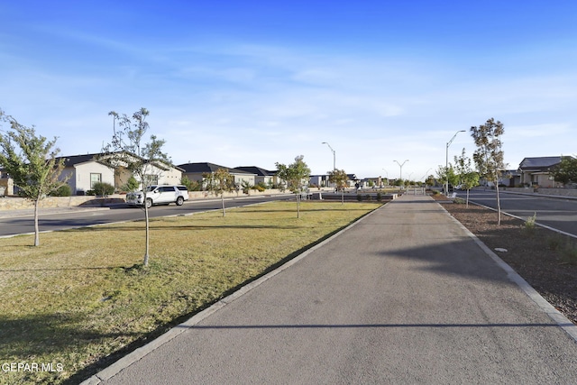 2528 Mike Price Dr, El Paso, TX 79938 - view of asphalt street with a residential view and street lights