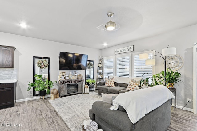 2528 Mike Price Dr, El Paso, TX 79938 - living area with light wood-style flooring and baseboards