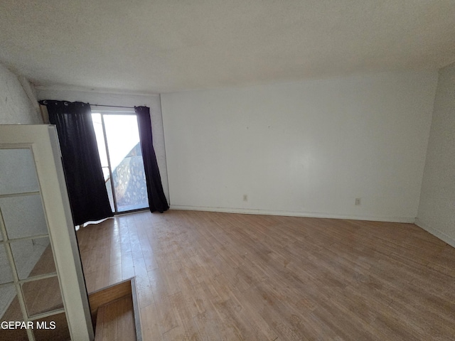 441 Irondale Dr, El Paso, TX 79912 - empty room with light wood-style flooring and baseboards
