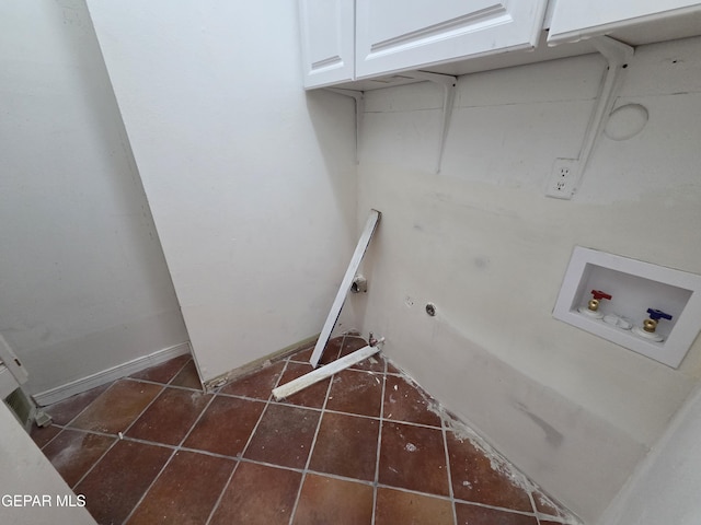 441 Irondale Dr, El Paso, TX 79912 - laundry room featuring hookup for a washing machine, cabinet space, dark tile patterned flooring, and gas dryer hookup