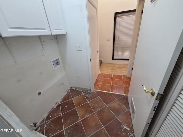 441 Irondale Dr, El Paso, TX 79912 - laundry room featuring cabinet space, washer hookup, dark tile patterned floors, and electric dryer hookup
