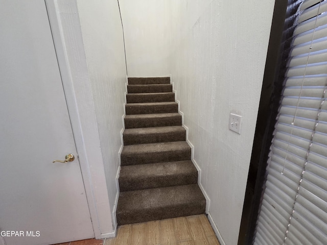 441 Irondale Dr, El Paso, TX 79912 - stairs featuring wood finished floors and baseboards