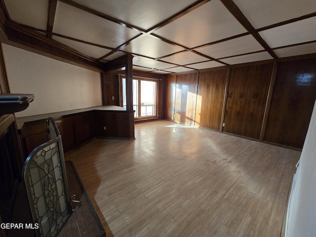 441 Irondale Dr, El Paso, TX 79912 - unfurnished living room with coffered ceiling, light wood-style floors, and wooden walls