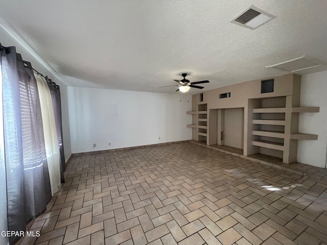 3208 Lampliter Pl, El Paso, TX 79925 - unfurnished living room featuring a ceiling fan, a textured ceiling, and baseboards