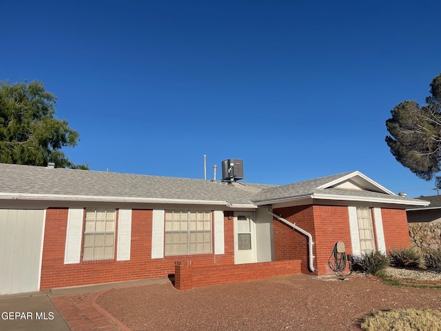 3208 Lampliter Pl, El Paso, TX 79925 - single story home with brick siding, roof with shingles, and central AC