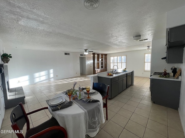 3208 Lampliter Pl, El Paso, TX 79925 - dining space featuring light tile patterned floors, ceiling fan, and a textured ceiling