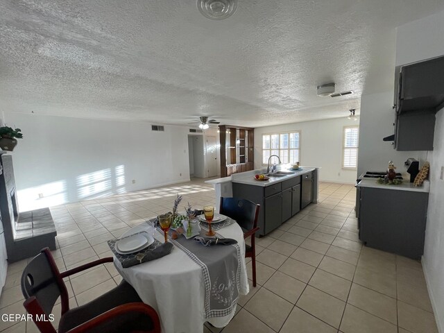 3208 Lampliter Pl, El Paso, TX 79925 - dining space with light tile patterned flooring, ceiling fan, and a textured ceiling
