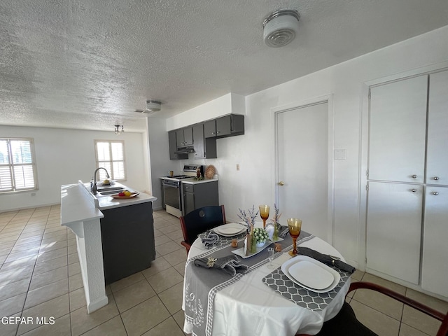3208 Lampliter Pl, El Paso, TX 79925 - dining room with a textured ceiling and light tile patterned floors