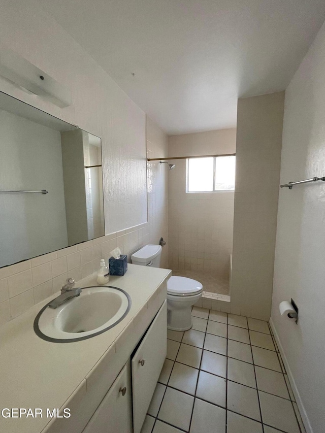 3208 Lampliter Pl, El Paso, TX 79925 - full bathroom with a shower stall, toilet, vanity, and tile patterned flooring
