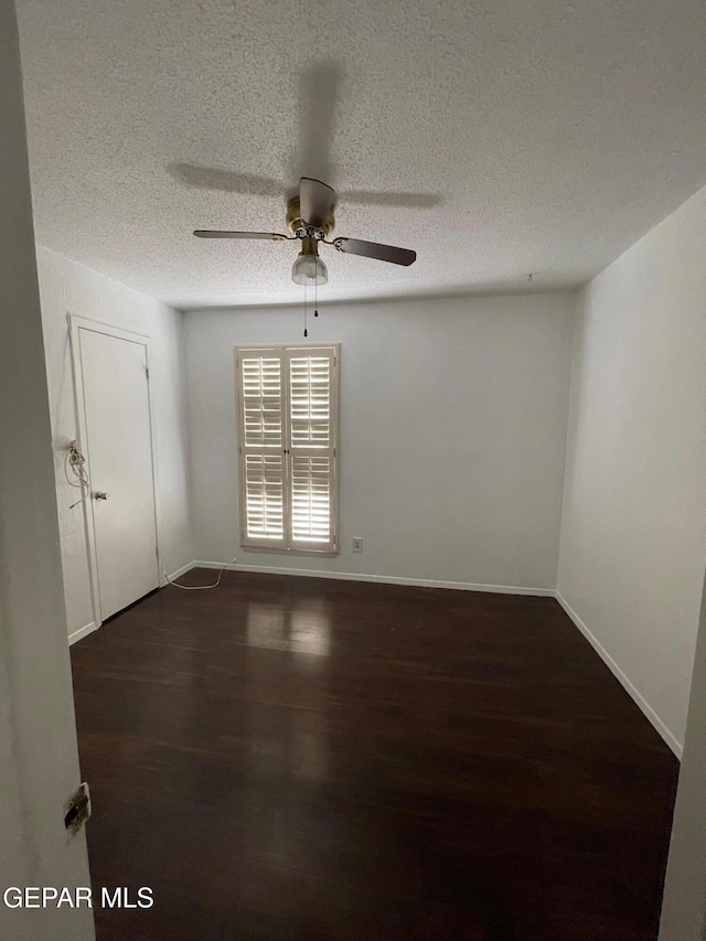 3208 Lampliter Pl, El Paso, TX 79925 - spare room with wood finished floors, a ceiling fan, a textured ceiling, and baseboards