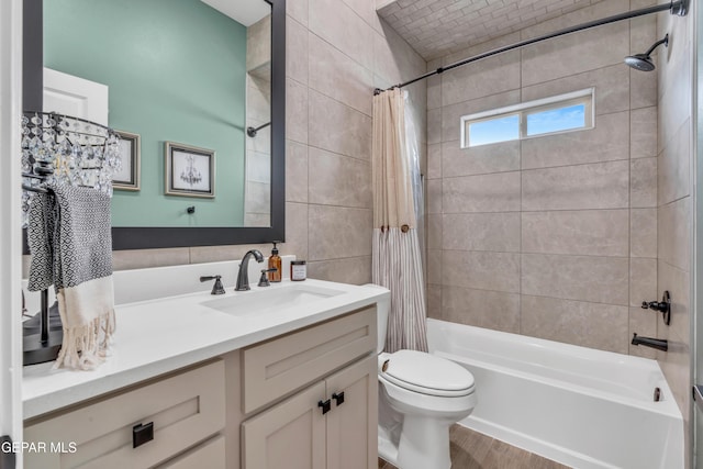 13107 Kington Ave, El Paso, TX 79928 - full bath featuring shower / bath combination with curtain, vanity, toilet, wood finished floors, and tile walls