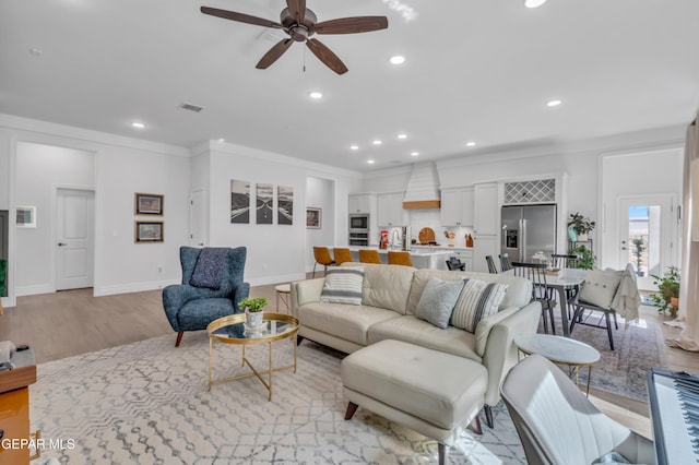 13107 Kington Ave, El Paso, TX 79928 - living area with ceiling fan, light wood-style flooring, recessed lighting, crown molding, and baseboards