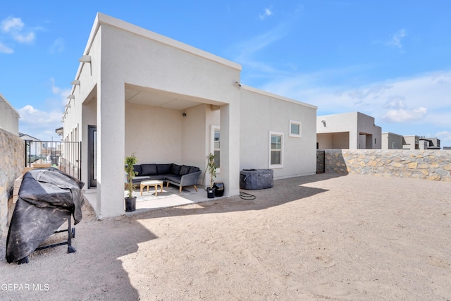 13107 Kington Ave, El Paso, TX 79928 - back of house featuring stucco siding, a patio, and an outdoor living space
