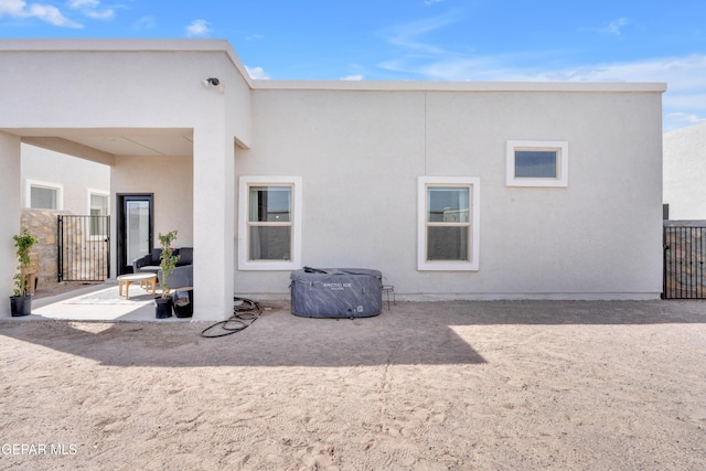 13107 Kington Ave, El Paso, TX 79928 - rear view of property with a gate and stucco siding