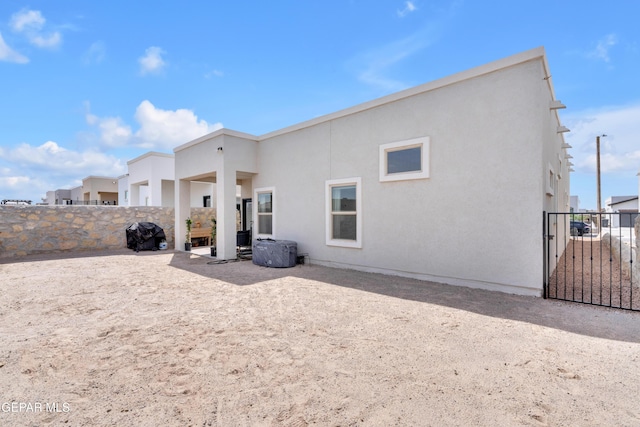 13107 Kington Ave, El Paso, TX 79928 - rear view of property with stucco siding and a gate