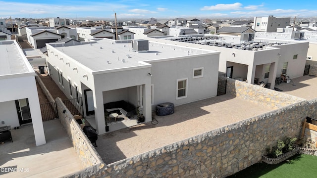 13107 Kington Ave, El Paso, TX 79928 - rear view of house with stucco siding, a residential view, and a patio