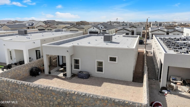 13107 Kington Ave, El Paso, TX 79928 - back of house featuring a residential view, stucco siding, and a patio