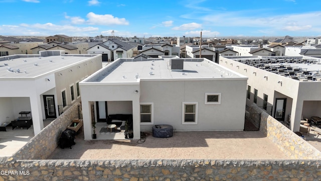 13107 Kington Ave, El Paso, TX 79928 - back of property with a residential view, stucco siding, and a patio