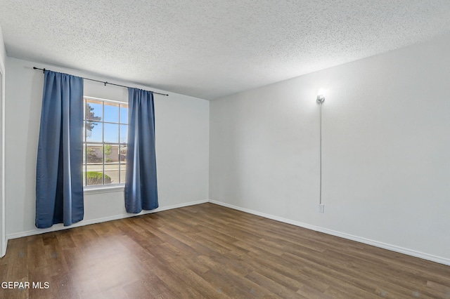9204 Rex Ct, El Paso, TX 79925 - unfurnished room featuring wood finished floors, a textured ceiling, and baseboards