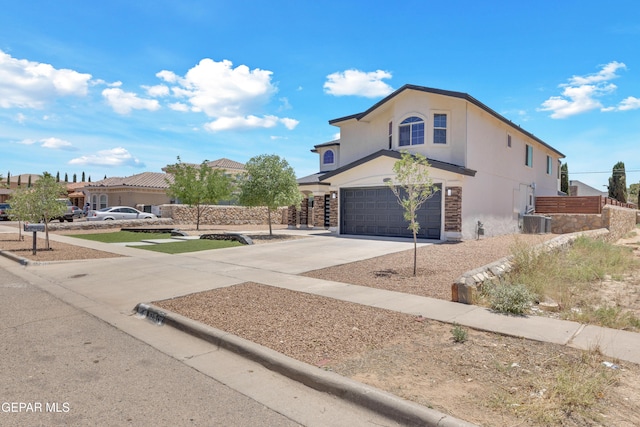 11316 Menlo Ave, El Paso, TX 79936 - view of front of property with an attached garage, stucco siding, and concrete driveway