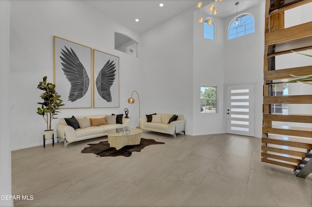 11316 Menlo Ave, El Paso, TX 79936 - living area featuring a towering ceiling, baseboards, and recessed lighting
