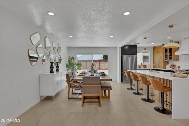 11316 Menlo Ave, El Paso, TX 79936 - dining space with a textured ceiling, recessed lighting, and baseboards