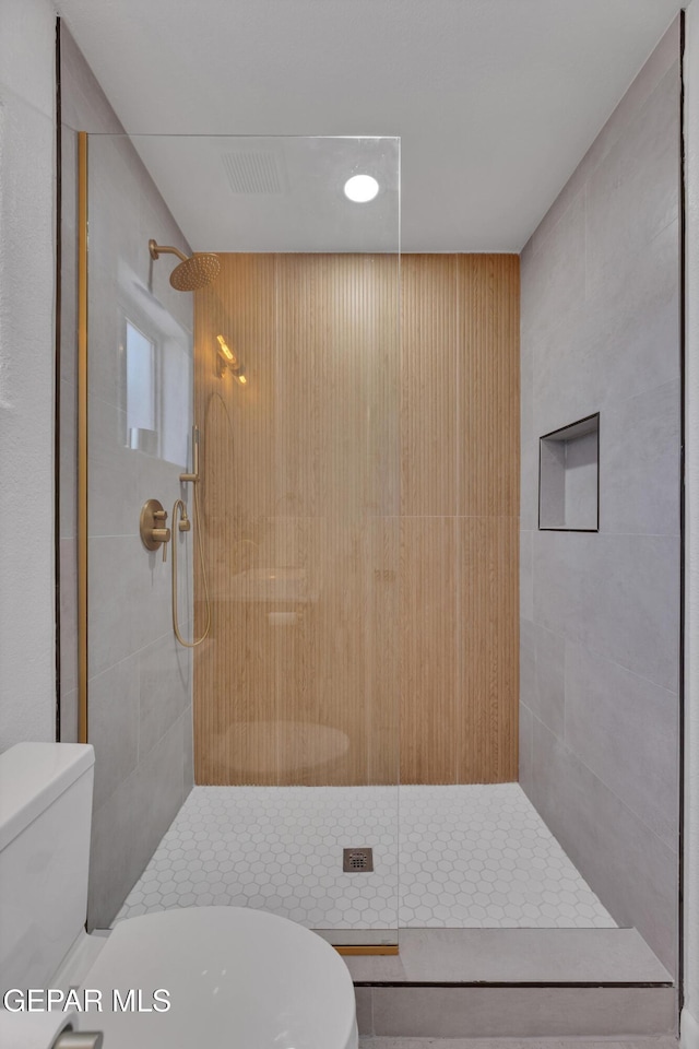 11316 Menlo Ave, El Paso, TX 79936 - bathroom featuring toilet and a stall shower