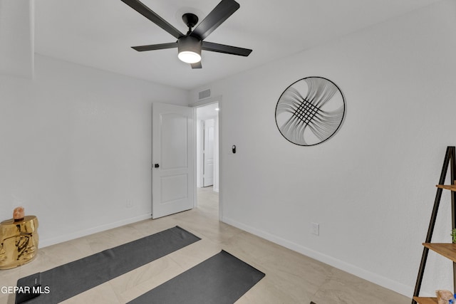 11316 Menlo Ave, El Paso, TX 79936 - workout room featuring ceiling fan, baseboards, and tile patterned flooring