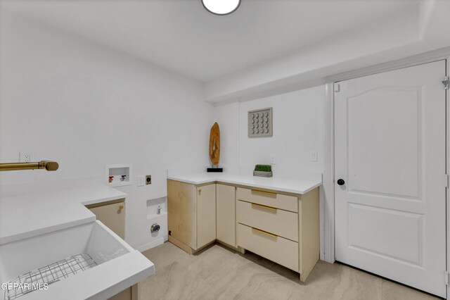 11316 Menlo Ave, El Paso, TX 79936 - washroom featuring hookup for an electric dryer, hookup for a washing machine, and cabinet space