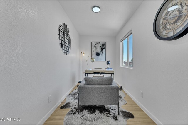11316 Menlo Ave, El Paso, TX 79936 - living area with baseboards and light wood-style floors