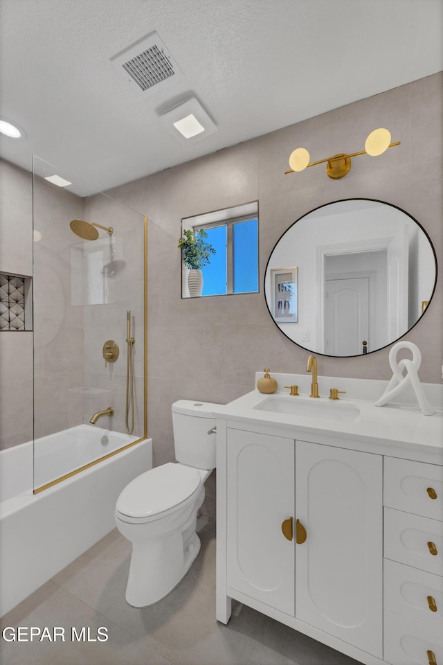 11316 Menlo Ave, El Paso, TX 79936 - bathroom with toilet, vanity, shower / washtub combination, and tile patterned flooring