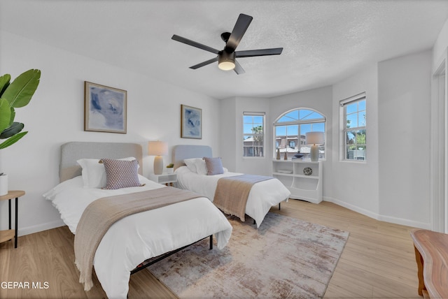 11316 Menlo Ave, El Paso, TX 79936 - bedroom featuring wood finished floors, baseboards, and ceiling fan
