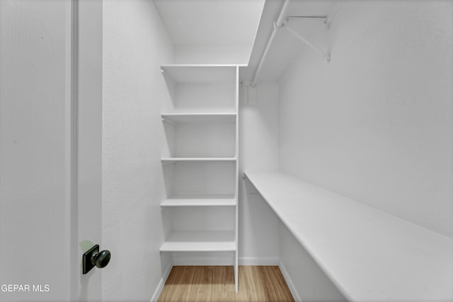 11316 Menlo Ave, El Paso, TX 79936 - walk in closet with wood finished floors