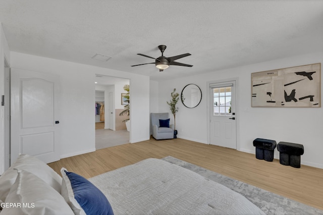 11316 Menlo Ave, El Paso, TX 79936 - living room featuring ceiling fan, wood finished floors, a textured ceiling, and baseboards