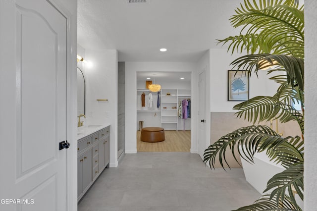 11316 Menlo Ave, El Paso, TX 79936 - full bathroom featuring vanity, a spacious closet, recessed lighting, and baseboards