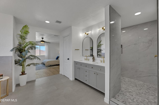 11316 Menlo Ave, El Paso, TX 79936 - ensuite bathroom featuring double vanity, ceiling fan, walk in shower, and recessed lighting