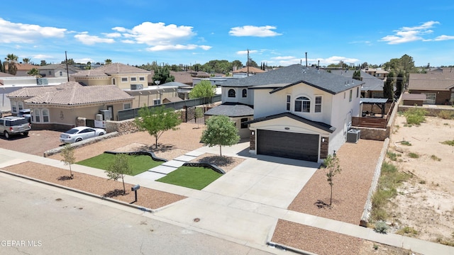 11316 Menlo Ave, El Paso, TX 79936 - view of front facade with a residential view, driveway, an attached garage, and stucco siding